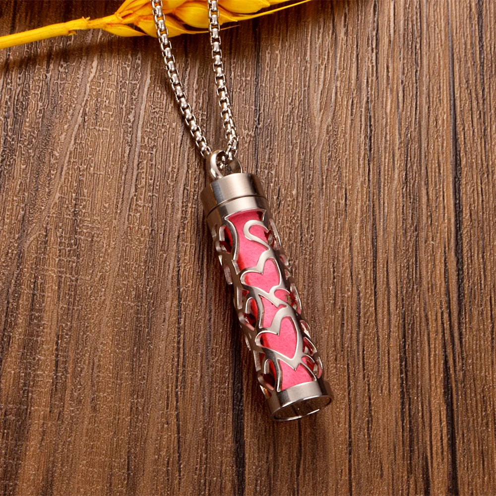Aromatherapy diffuser necklace with interchangeable pads 
